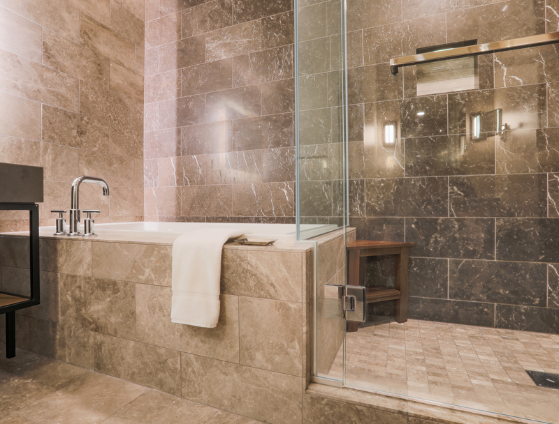 modern tiled bathroom with shower and bath